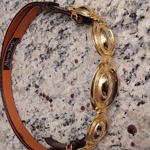 Alexis Kirk brown snake leather adjustable belt with gold front .